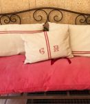 Petit canapé d’extérieur en fer forgé + coussins