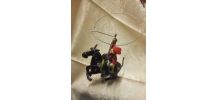 Jouet en tôle cavalier au lasso