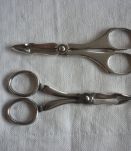 2 pinces a sucre forme ciseaux en metal argenté