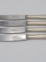 Anciens couteaux en métal argenté