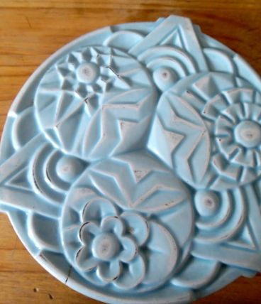 dessous de plat en fonte art déco