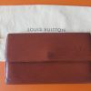 Portefeuille Vintage en cuir épi de la maison Louis Vuitton.