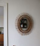 Superbe miroir soleil oval d'époque en rotin 60s