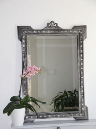 Miroir ancien en bois sculpté, patiné noir et argent