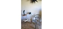 Fauteuil rotin coquille année 50