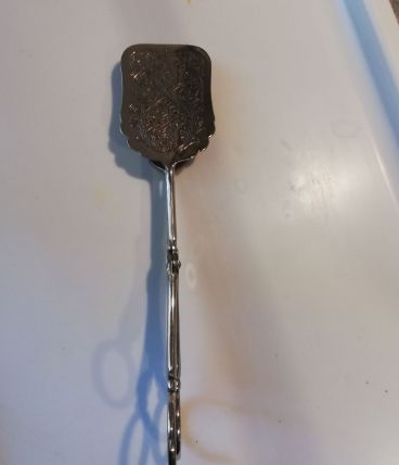 Pince métal argenté vintage
