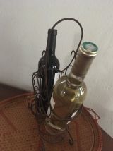Porte bouteilles en fer vieilli.