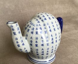 Théière chinoise à remplissage par le dessous.