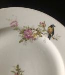 10 assiettes à décor d'oiseaux