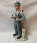 Chasseur à la pipe avec son chien