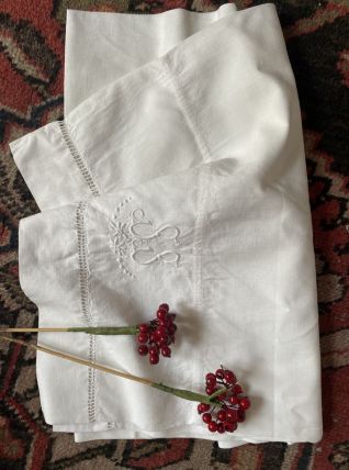 Taie traversin ancienne en coton blanc brodé.