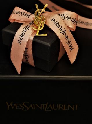 Broche monogramme YSL