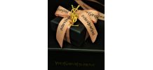 Broche monogramme YSL