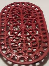 dessous de plat en fonte rouge