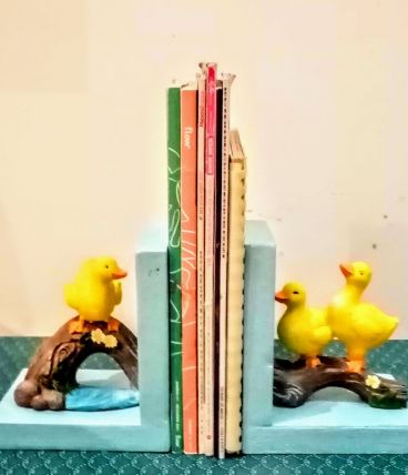 Serre livres canards jaunes