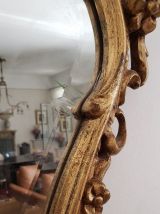 Important miroir en bois doré