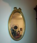 Miroir médaillon doré style Louis XVI