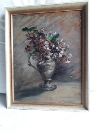 Tableau ancien à l'huile représentant un bouquet de fleurs.