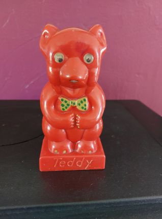 TIRELIRE TEDDY L'OURSON PLASTIQUE DUR ROUGE. ANNEE 50/60