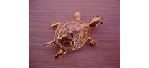Broche vintage "tortue" en métal doré garnie de strass