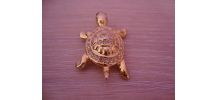 Broche vintage "tortue" en métal doré garnie de strass