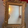 Miroir doré XIXème fronton en faisceaux, glace au mercure