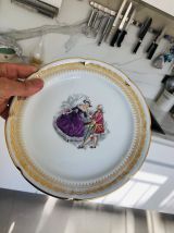 12 assiettes  décor galant porcelaine Limoges