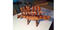 Statue africaine (pirogue et guerriers)