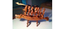 Statue africaine (pirogue et guerriers)