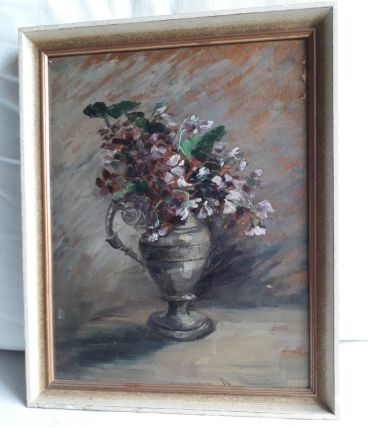 Tableau ancien à l'huile représentant un bouquet de fleurs.