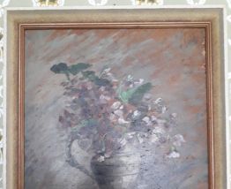 Tableau ancien à l'huile représentant un bouquet de fleurs.