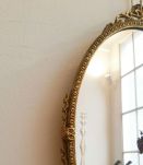 Miroir ovale ancien en métal doré