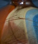 Vase boule en céramique vernis signé