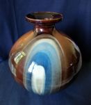 Vase boule en céramique vernis signé