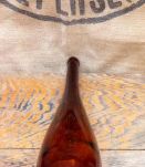 Jolie bouteille en verre ambré 