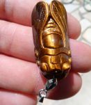 pendentif oeil de tigre sculpté