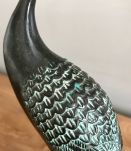 Bronze à patine verte.