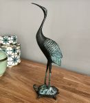 Bronze à patine verte.