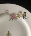 10 assiettes à décor d'oiseaux