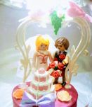 Lampe cage d'oiseaux argentée et rose à poser