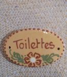 Plaque en terre cuite "toilettes"