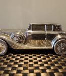 Tirelire en forme de voiture d'époque, étamé.
