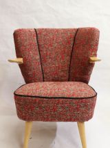 Fauteuils vintage année 60 accoudoirs suspendus refait neuf.