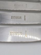 Anciens couteaux en métal argenté