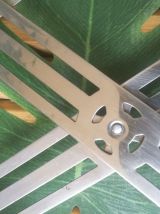 dessous de plat en métal accordéon