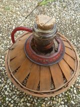 dame jeanne recouverte  en bois, vintage