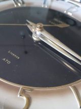 pendule murale formica noire et or marque TROPHY Transistor