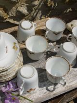 Service de 10 tasses à café et leurs soucoupes 