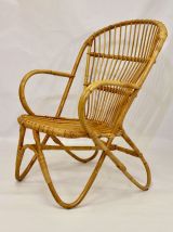 Fauteuil vintage en rotin année 60 pieds papillons.