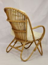 Fauteuil vintage en rotin année 60 pieds papillons.